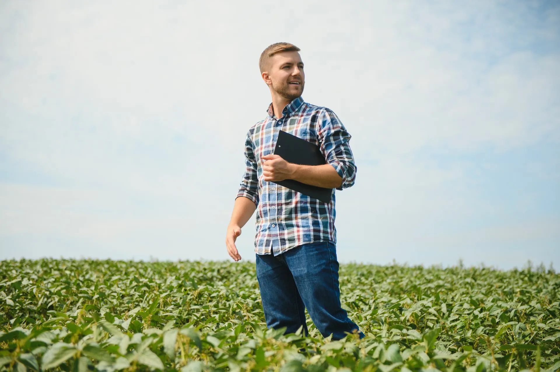 farmer-agronomist-examine-green-soybean-plants-field.jpg